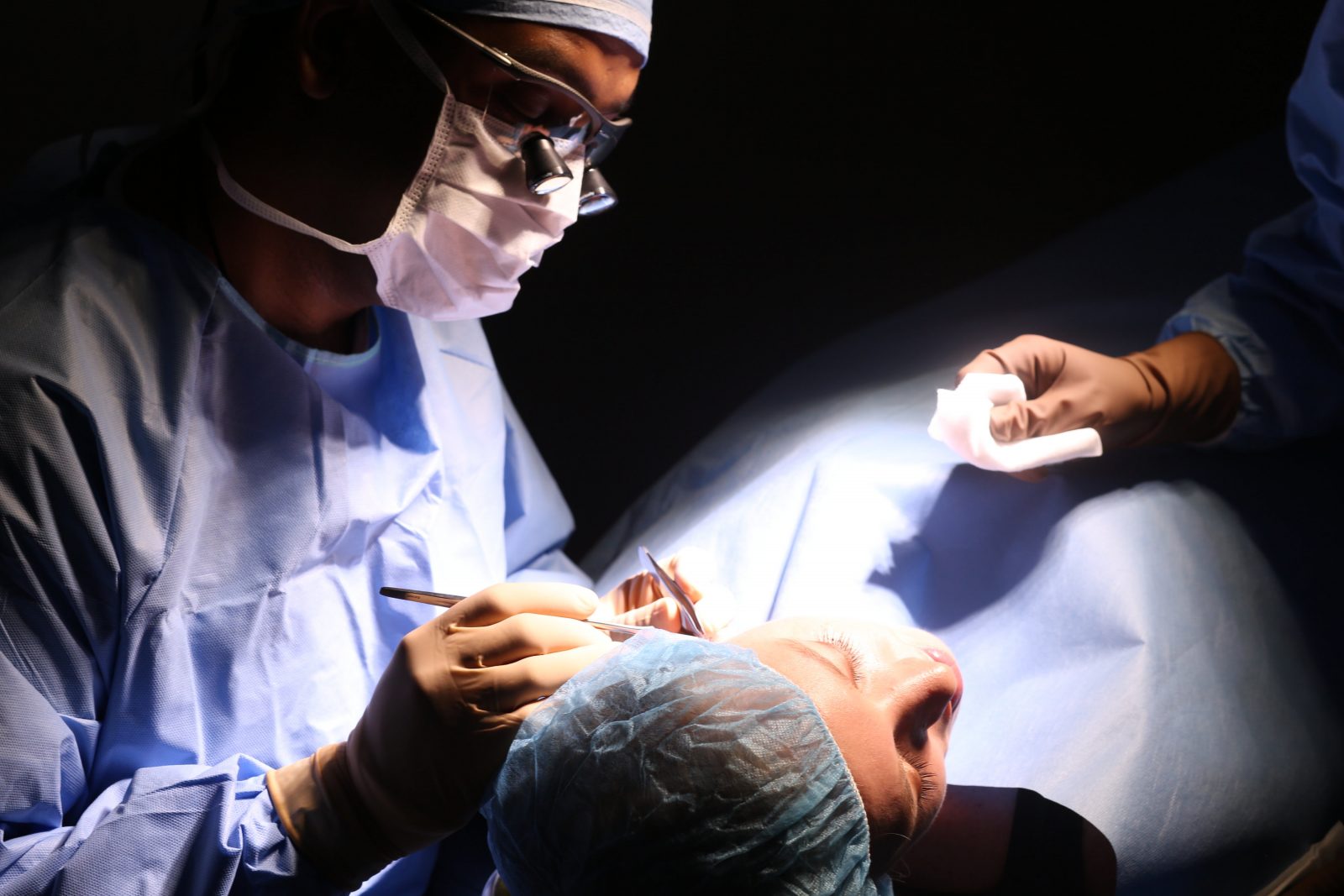 Dr. Kundaria of Nuance Facial Plastics performing facial plastic surgery